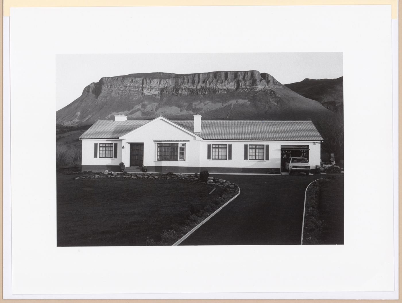 Bungalow in front of rock formation, Glencar, County Sligo, Ireland