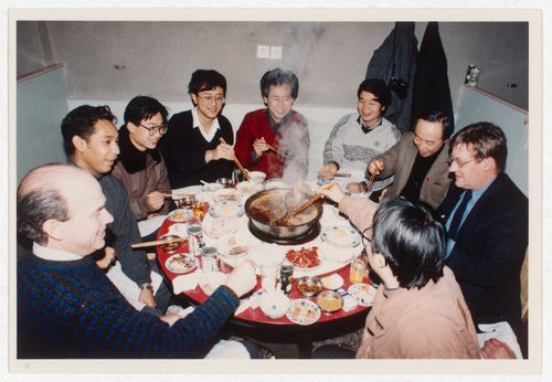 Participants of the "Rural Housing: A First Step to Market Housing" international workshop sharing a meal
