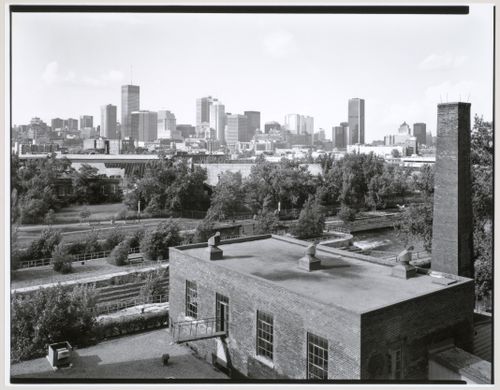 View of Lachine Canal and the Caledonian Ironworks Building looking north northwest from the roof of the Belding Corticelli Spinning Mill with downtown Montréal in the background, Québec