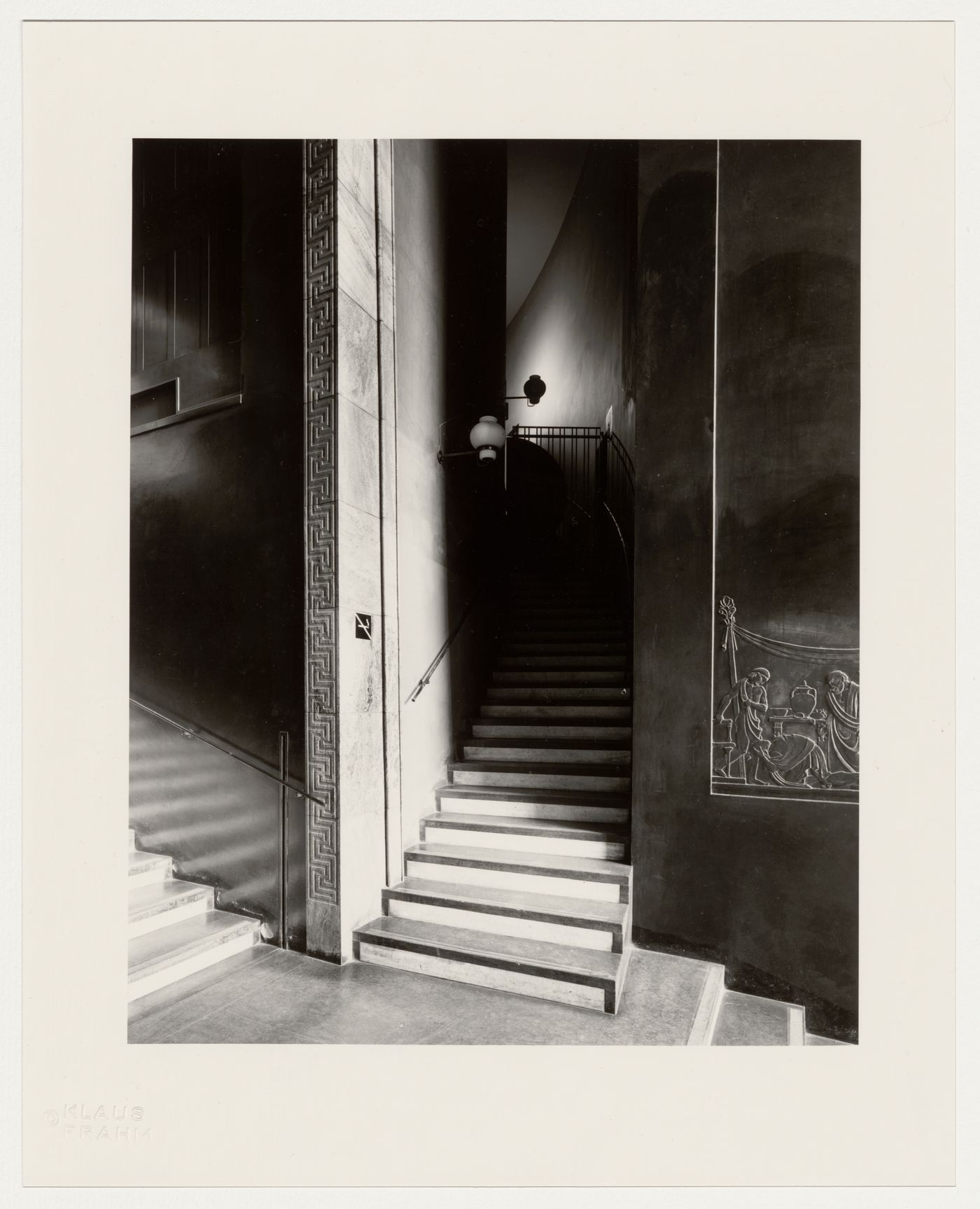 Interior view of the stairs leading from the lobby to the lending hall of Stockholm Public Library showing a bas-relief depicting a scene from the Iliad sculpted by Ivar Viktor Johnsson, 51-55 Odengatan, Stockholm, Sweden