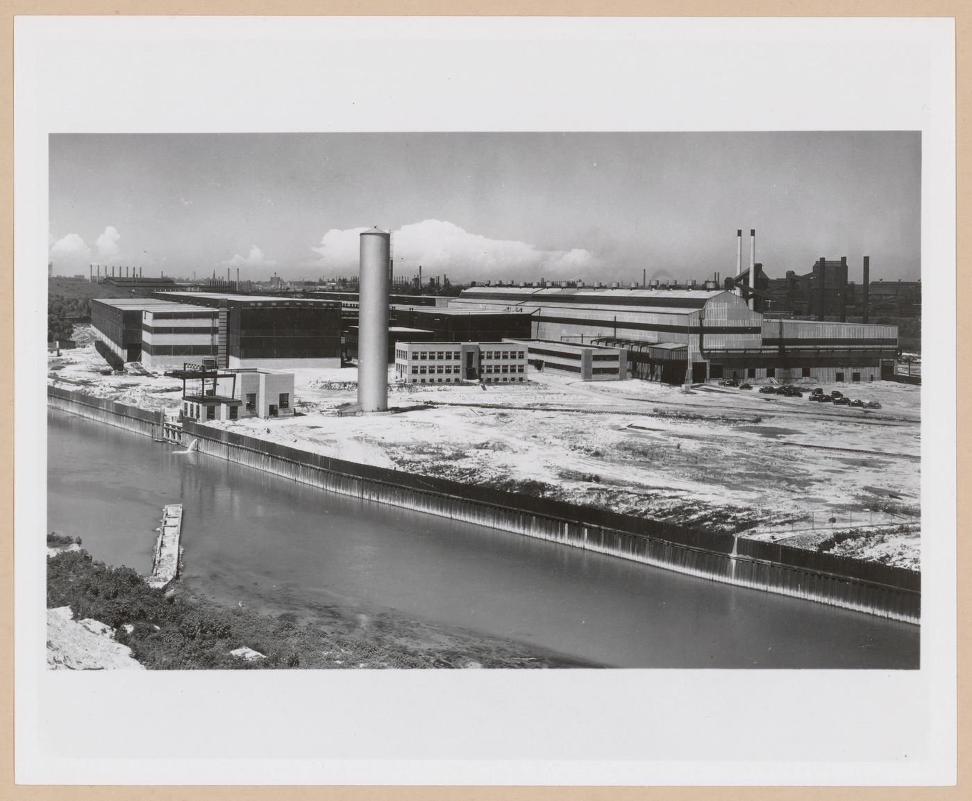 View of the Strip Mill, Administration Building and Welfare Building from across a canal, Republic Steel Corporation Assembly Plant [?], Cleveland, Ohio