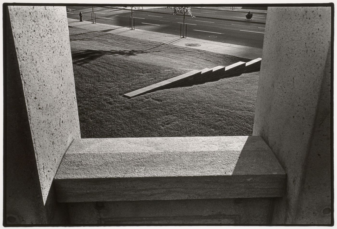 View of one of the cadastral walls which represent rural "rangs" or property lines through an opening in the arcade, CCA garden, Montréal, Québec, Canada