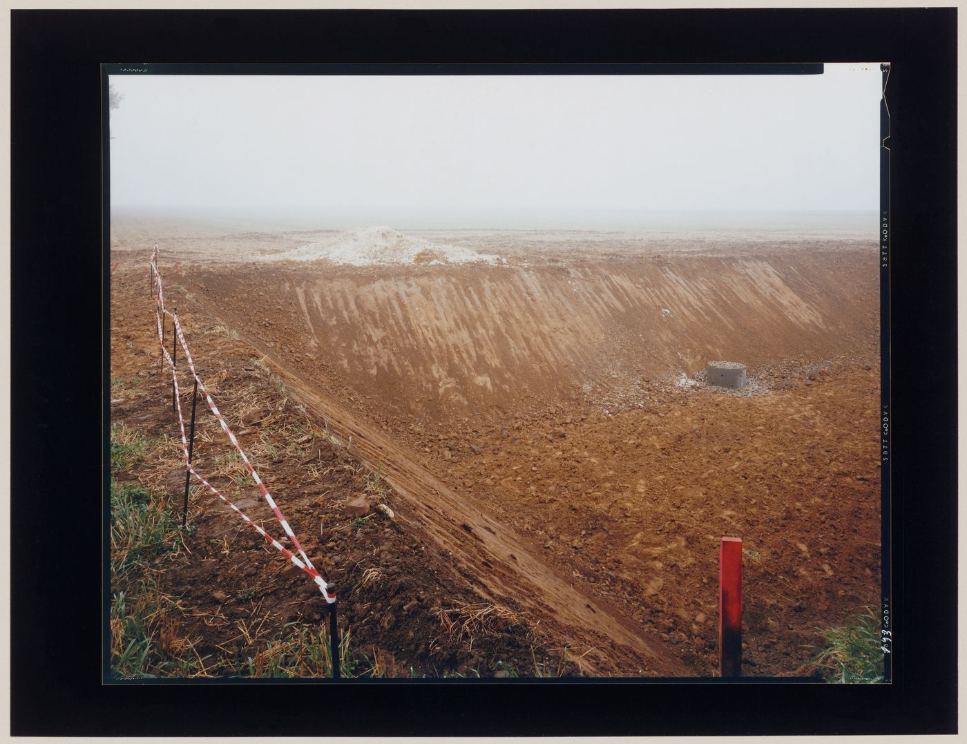 View of an excavation showing striped caution tape, Leuze, near Namur, Belgium (from the series "In between cities")
