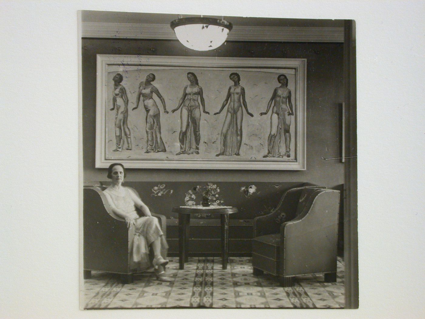 Portrait of Mrs. Hodler in the living [?] room of the Hodlers' apartment showing a painting and furnishings, 29 Quai du Montblanc, Geneva, Switzerland
