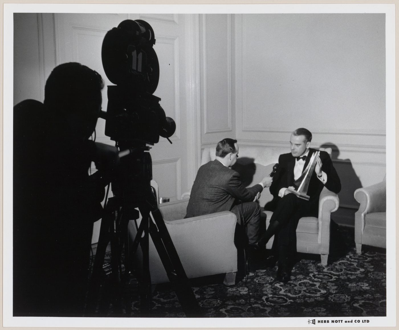 Parkin being interviewed for television holding award at Department of Industry and Nation Design Council's Structural Steel awards dinner at Royal York Hotel, Toronto