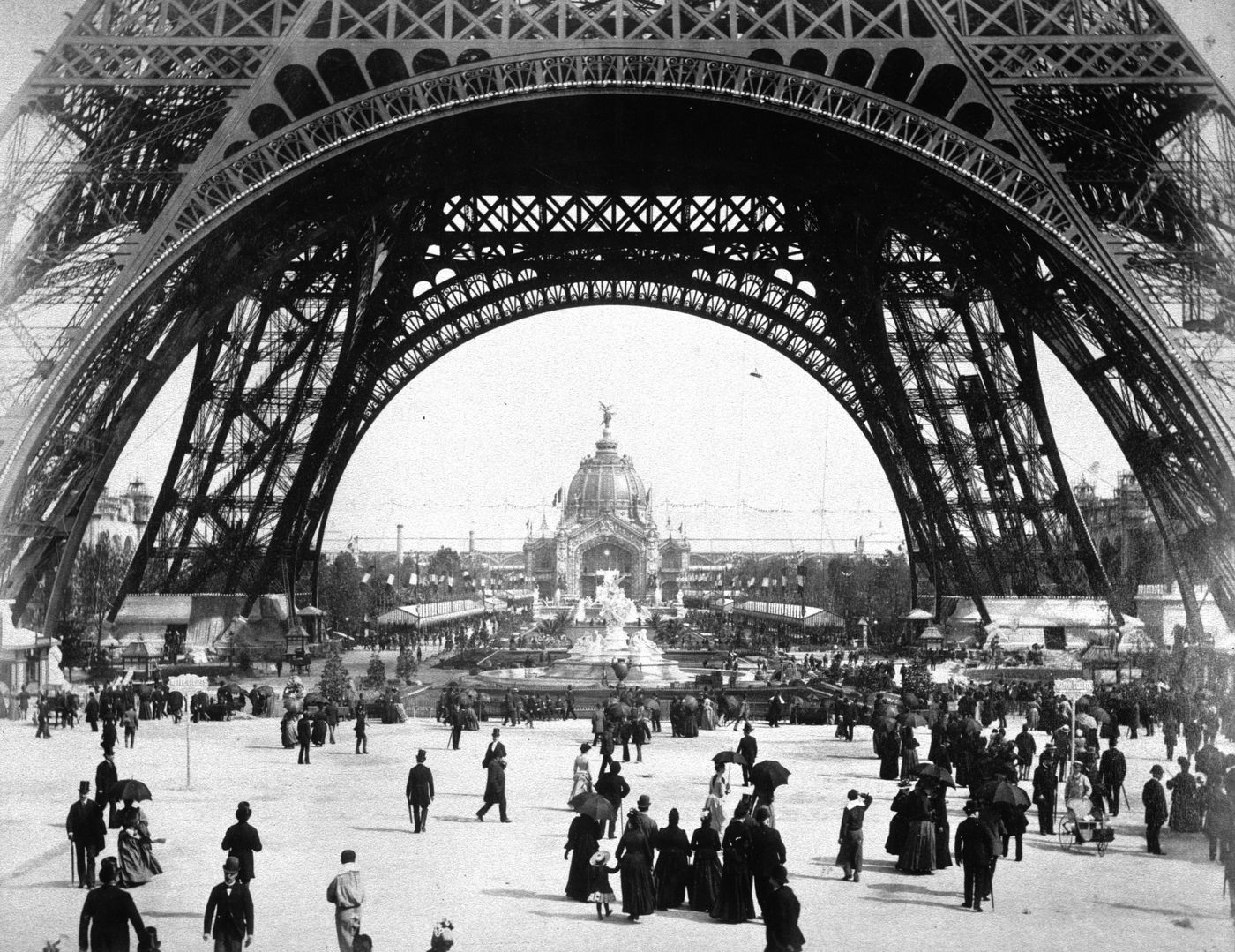 Exposition universelle de 1889 (Paris, France): View of the base of the Eiffel Tower with crowds beneath