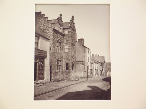 Exterior view of ancient house and other houses in street, Conway, Wales