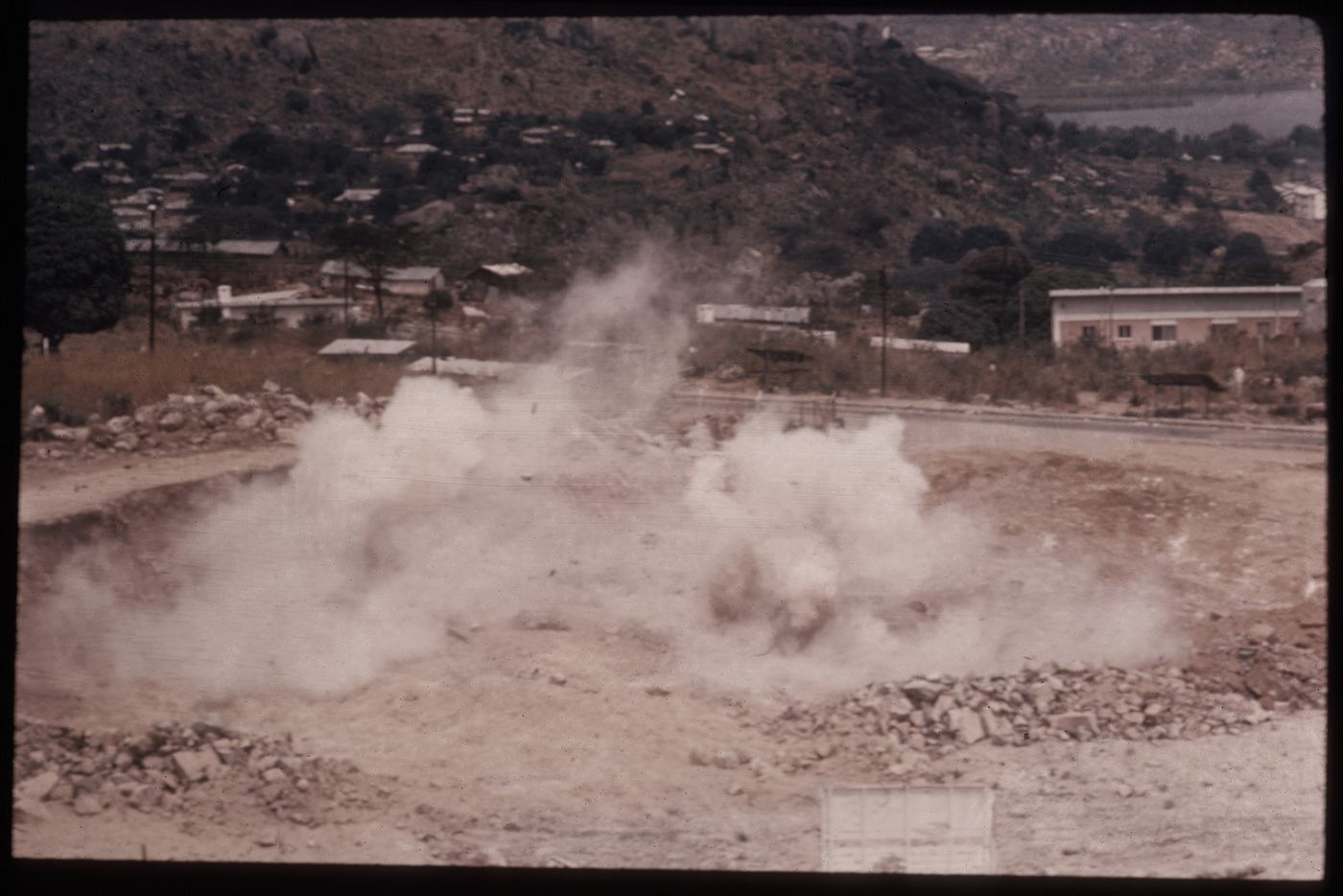 An explosion to clear the top of Bugando Hill for the construction of Bugando Medical Centre, Mwanza, Tanzania