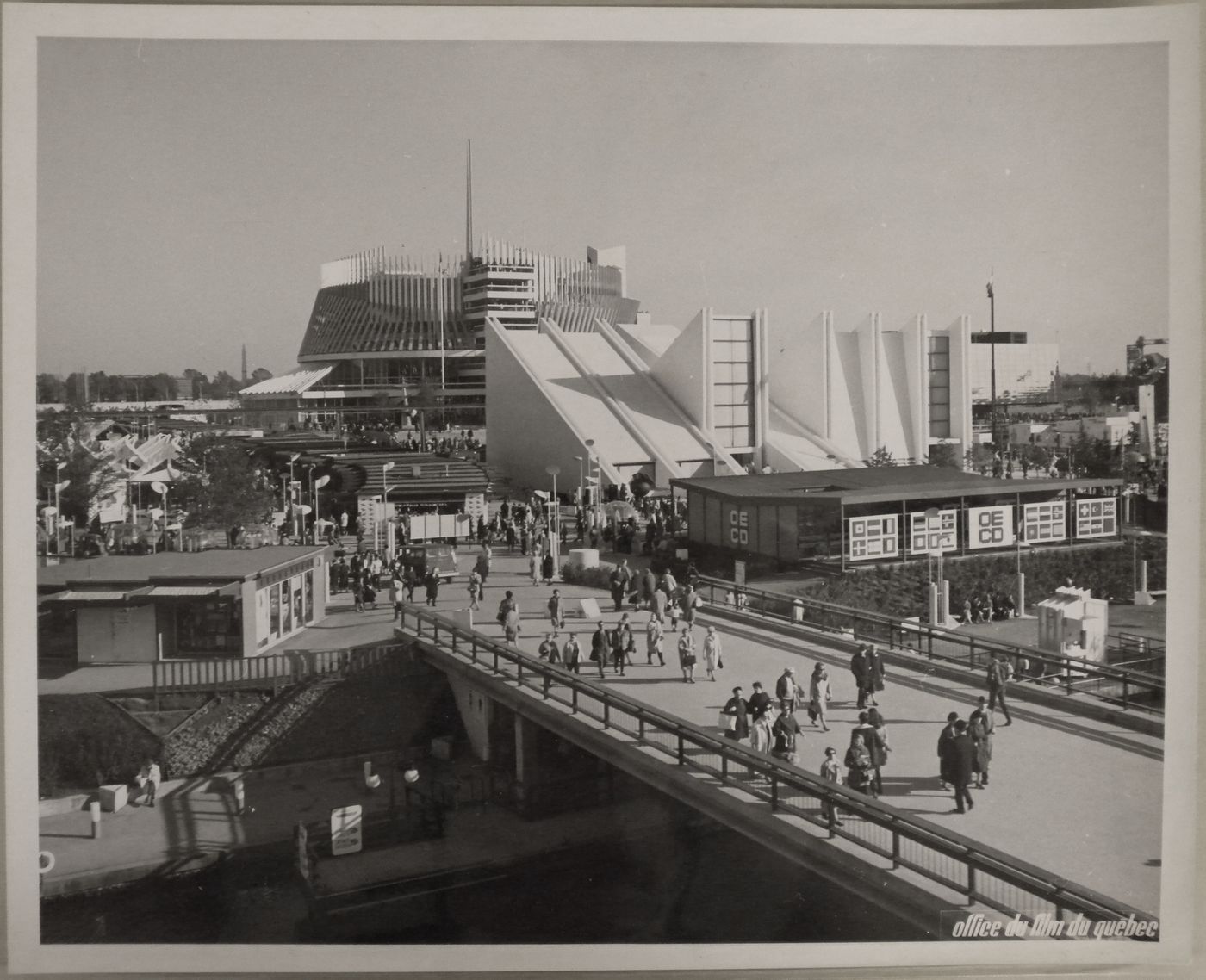 View of the bridge leading to the OECD and Yugoslav Pavilions with the Pavilion of France in background, Expo 67, Montréal, Québec