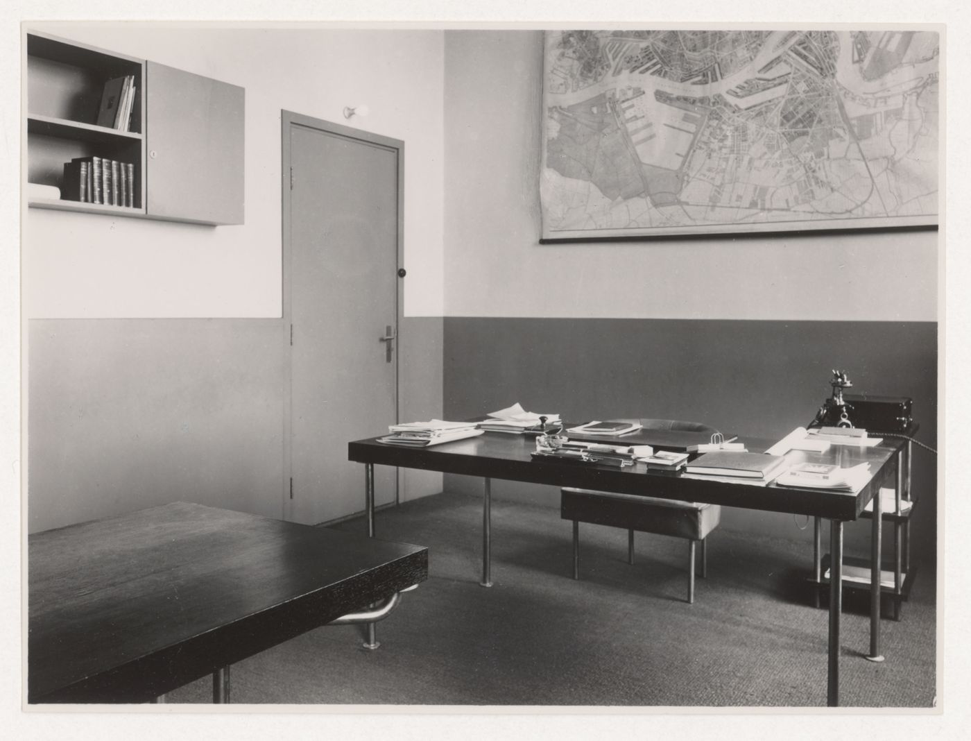 Interior view of M.J.I de Jonge van Ellemeet's office in Rotterdam City Hall showing the tables and a chair designed by J.J.P. Oud, Rotterdam, Netherlands