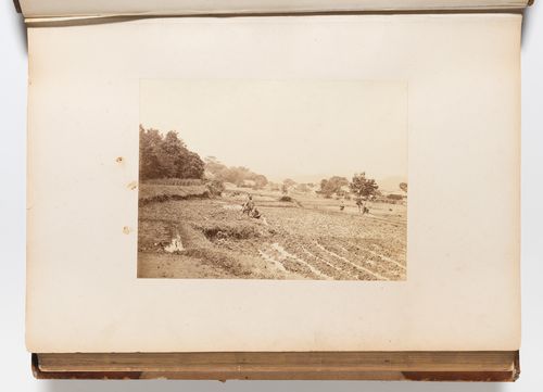 View of farmers in a field with a village in the background and Mount Fuji (also known as Fuji-san) in the distance, Chubu, Japan