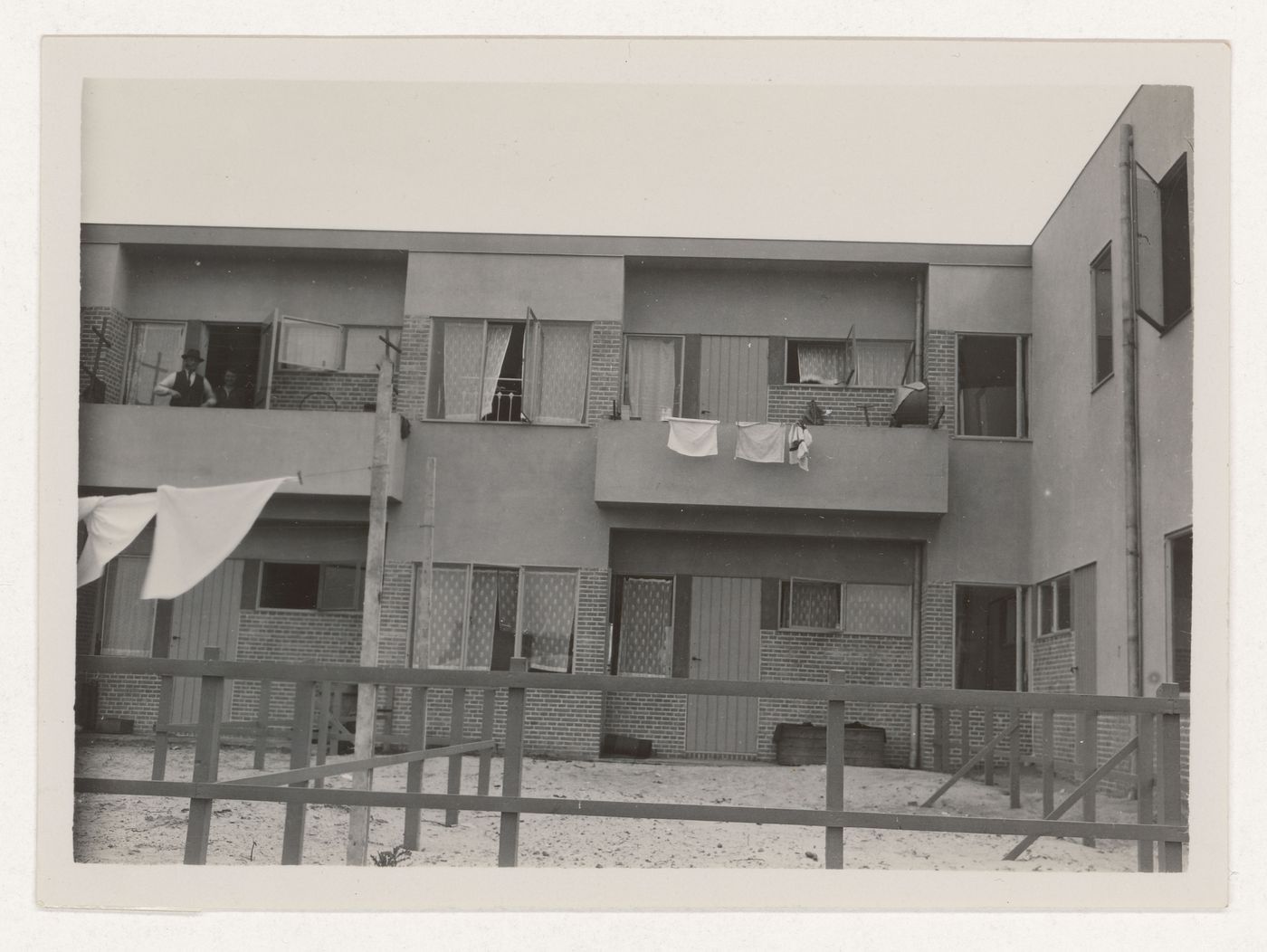 View of the rear façade of industrial row houses showing balconies and back yards, Hoek van Holland, Netherlands