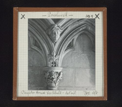 Detail view of blind arcade with capital and sculpture of head in vestibule of Chapter House, Southwell Minster, Southwell, Nottinghamshire, England