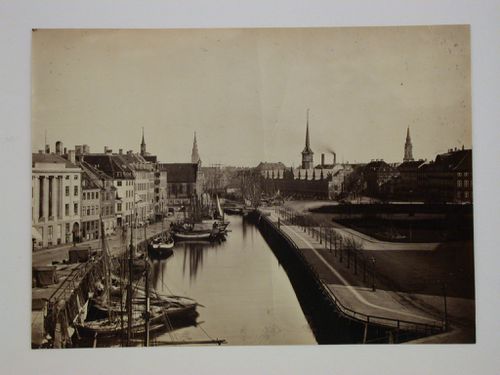 View of buildings along canal looking towards the old Stock Exchange (Borsen) and Von Frelsers Kirke, Copenhagen, Denmark