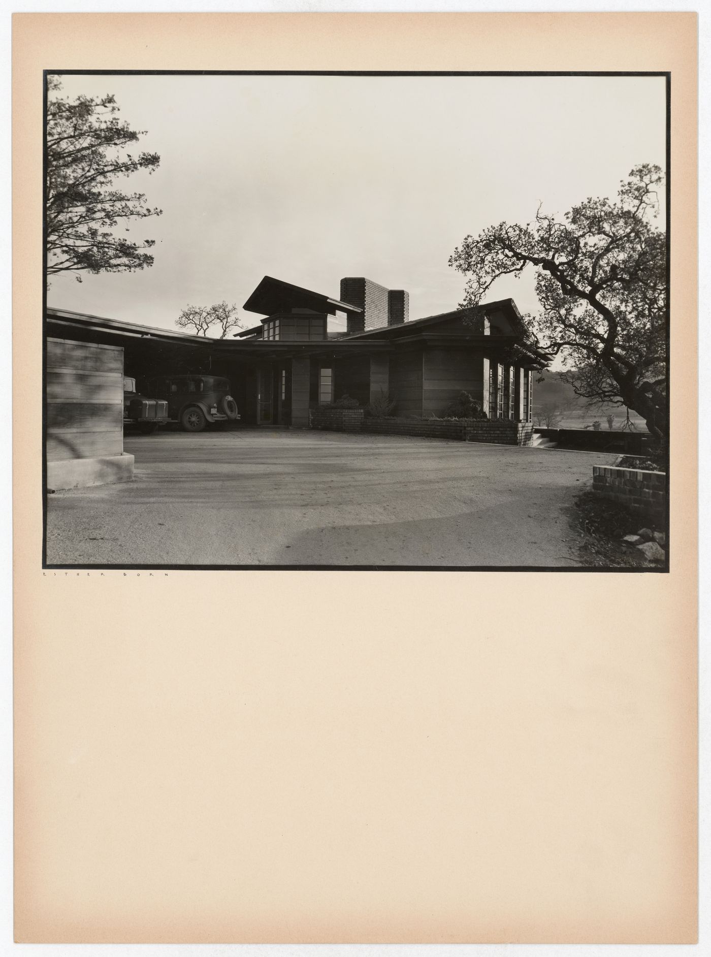 View of the Hanna House showing the carport, automobiles, windows, and overhangs, Palo Alto, California, United States