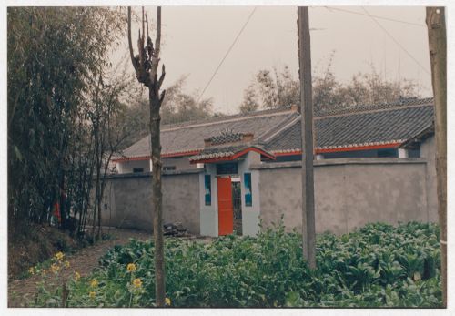 View of cultivated field and rural house in Sichuan province, China