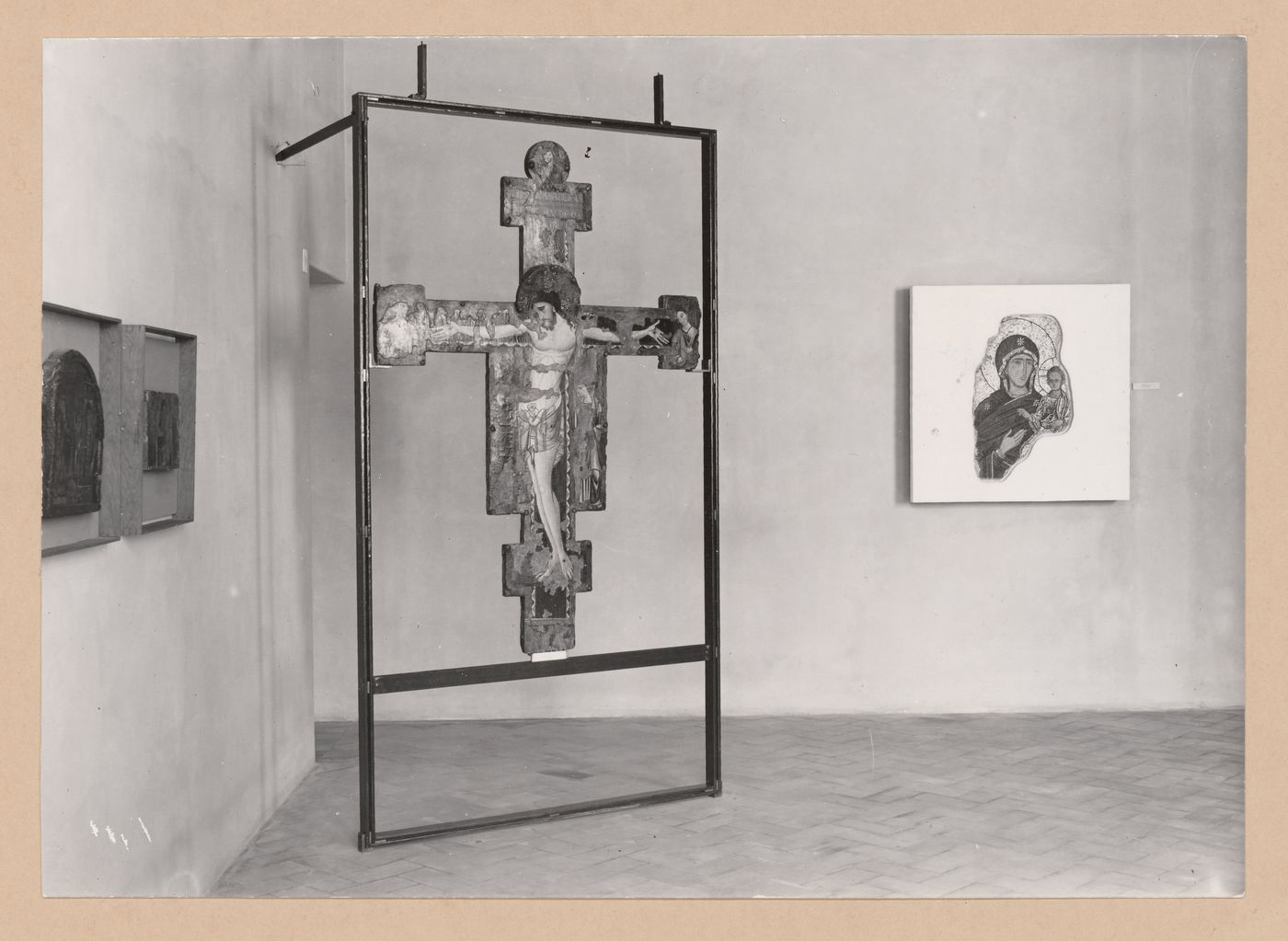 Interior view of the Sala della croce giunteesca showing a painted crucifix mounted on a metal easel and a painting, Palazzo Abatellis, Galleria regionale della Sicilia, Palermo, Italy