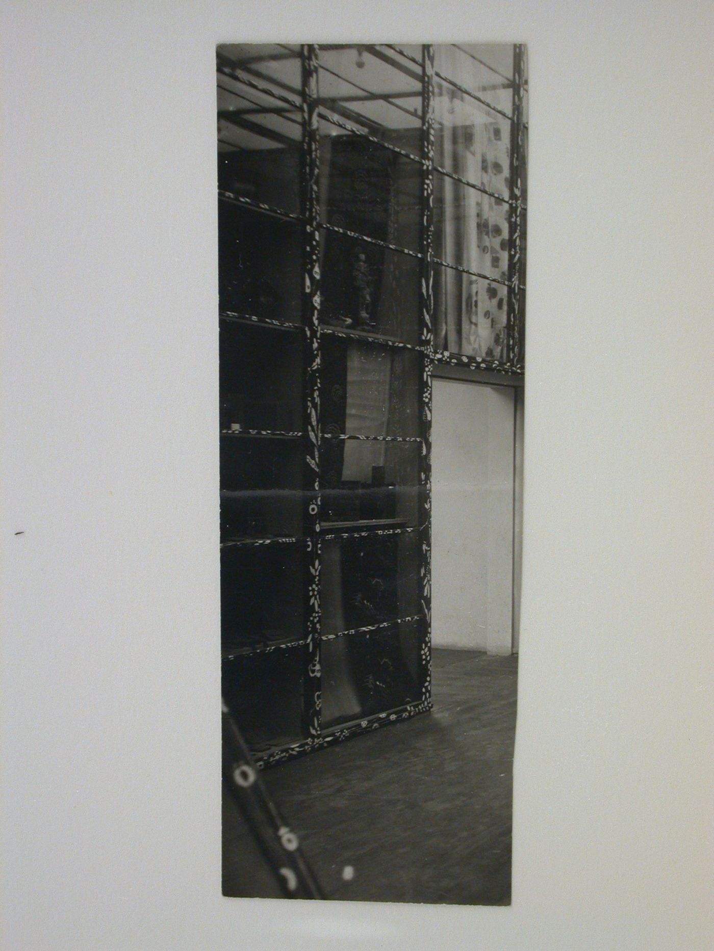 Interior view of a wall of exhibit cases in the Main Exhibition Hall of the Austrian Pavilion, International Exhibition of Modern Decorative and Industrial Arts [Exposition internationale des arts décoratifs et industriels modernes], Paris, France