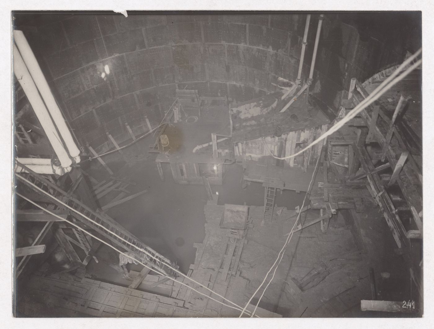 Construction of the Paris Metro, interior view of tunnel with large circular water filled pit, Paris, France