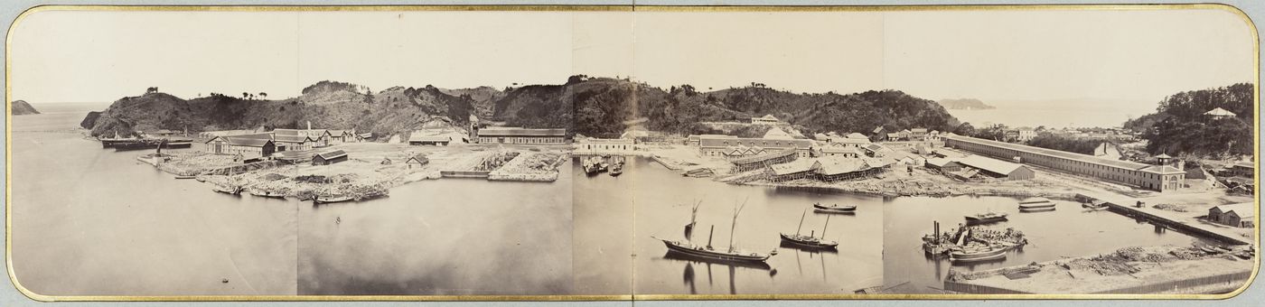 Panorama of the Yokosuka shipyard showing industrial buildings, dry docks and ships under construction, near Yokohama, Japan