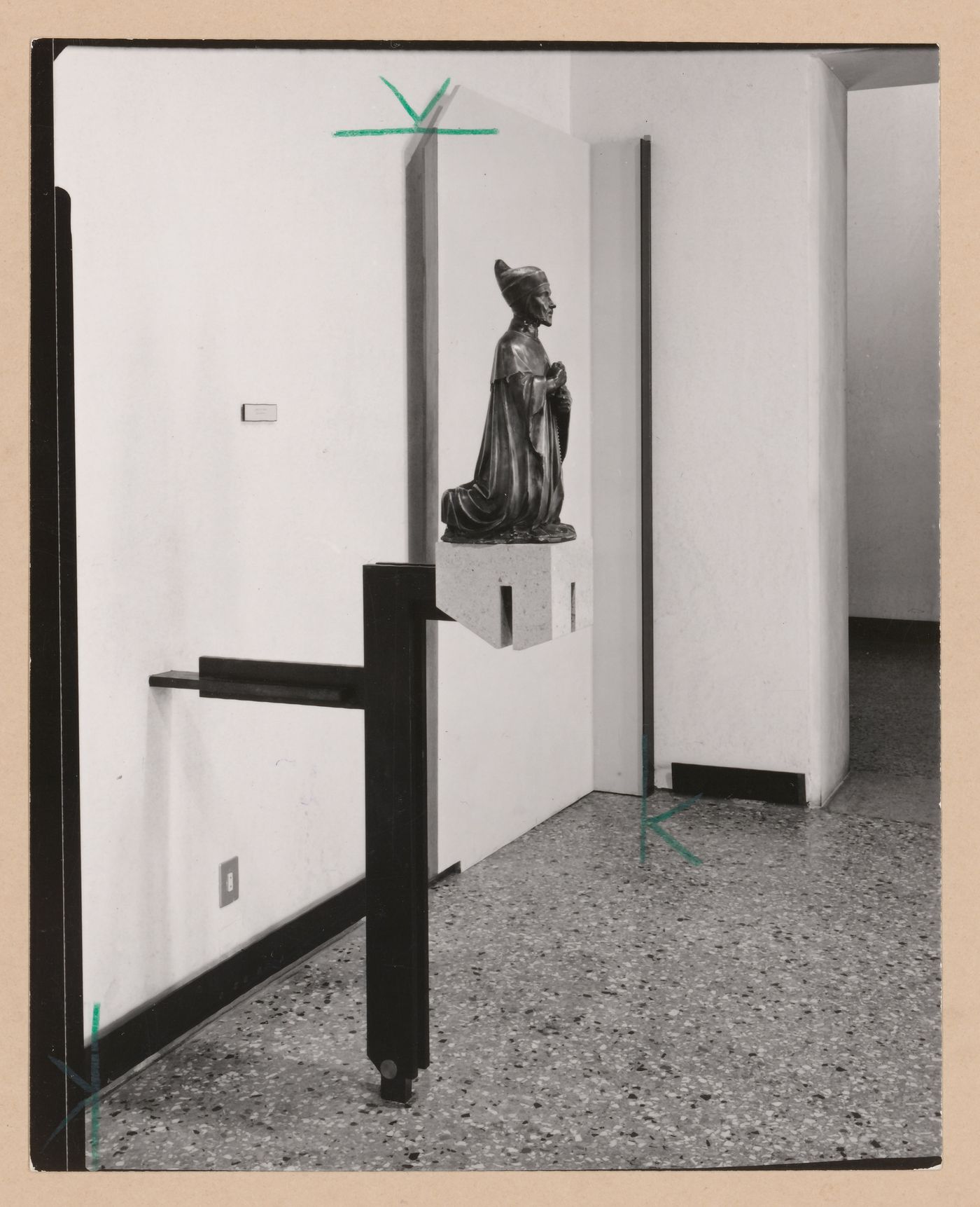 Interior view of a gallery showing a sculpture of a kneeling man, Museo Correr, Venice, Italy