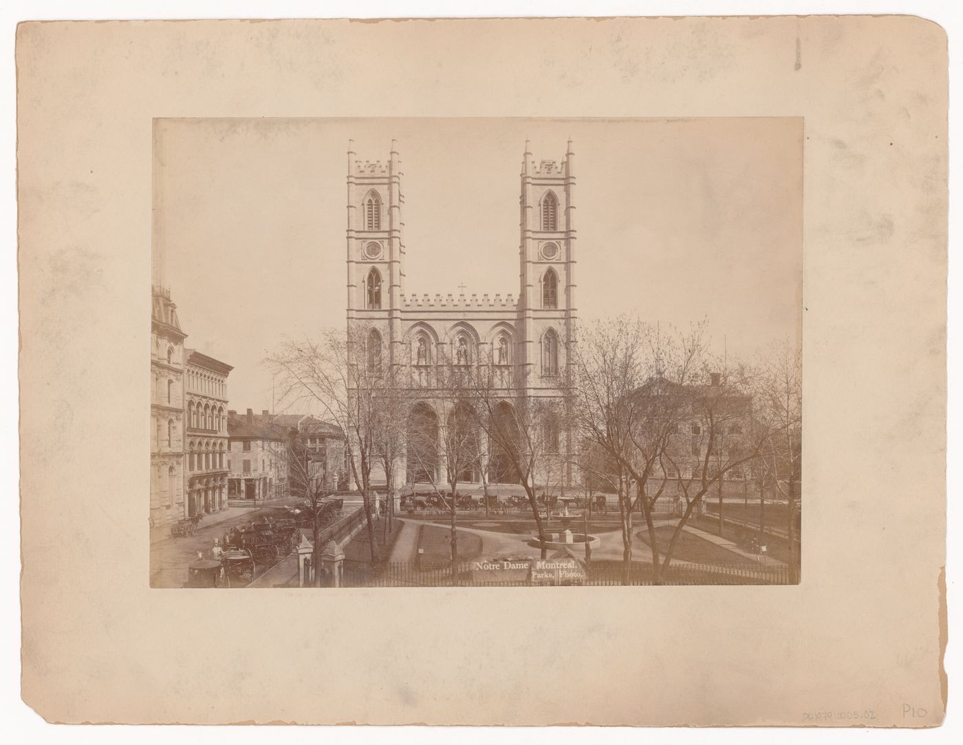 View of Basilique Notre-Dame from across Place-d'Armes with the rectory on the right, Montréal, Québec