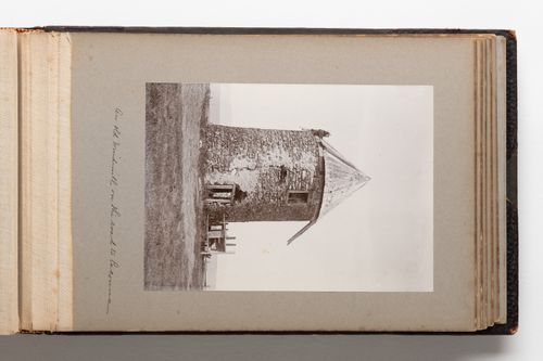 View of a round stone structure identified as a windmill in a field, Quebec, Canada