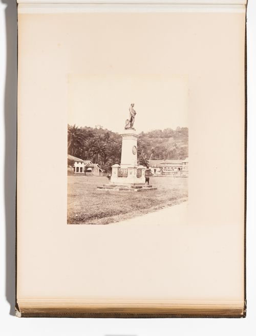 View of the statue of Sir Henry George Ward with the Temple of the Tooth (also known as the Sri Dalada Maligawa) in the background, Kandy, Ceylon (Sri Lanka)