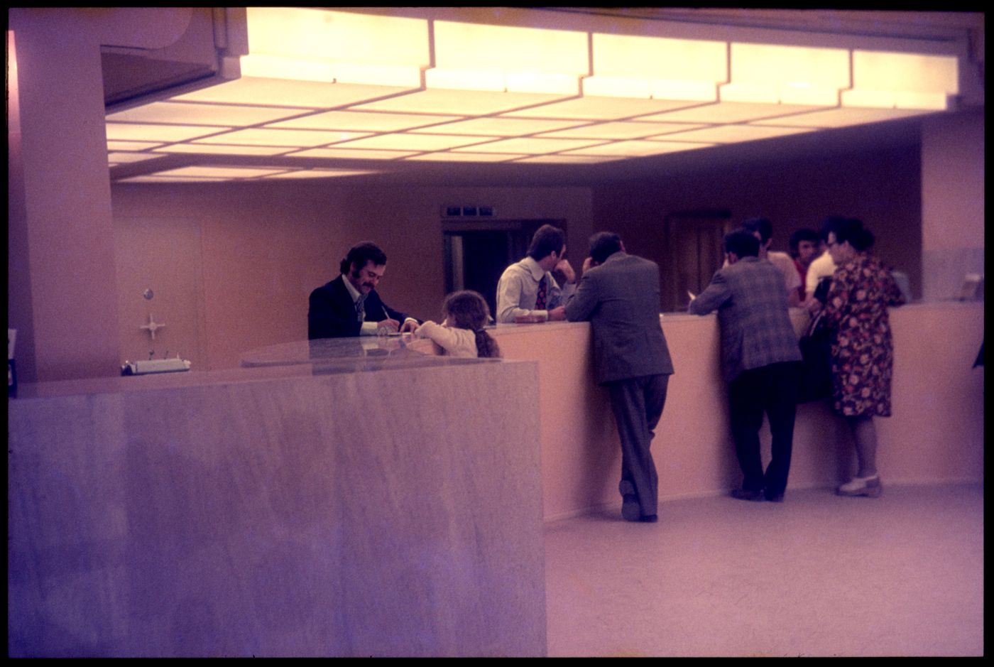 View of people and interior of Banco Pinto & Sotto Mayor, agência e clube, Lamego, Portugal