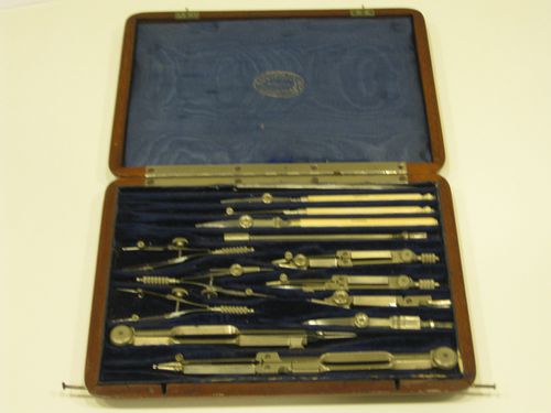 14 drawing instruments in a wooden case