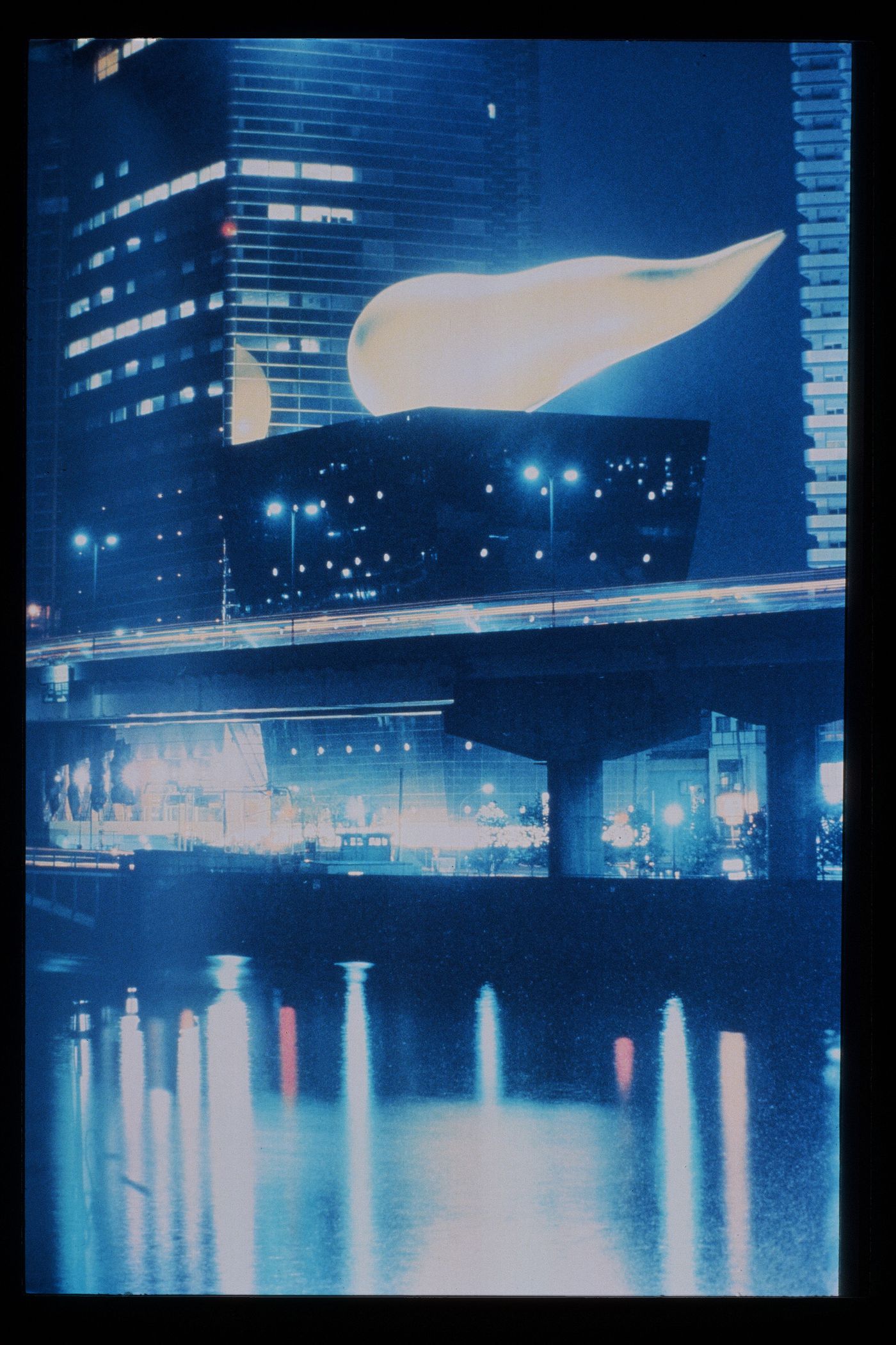 Slide of a photograph of Asahi Superdry Hall, Tokyo, by Philippe Starck