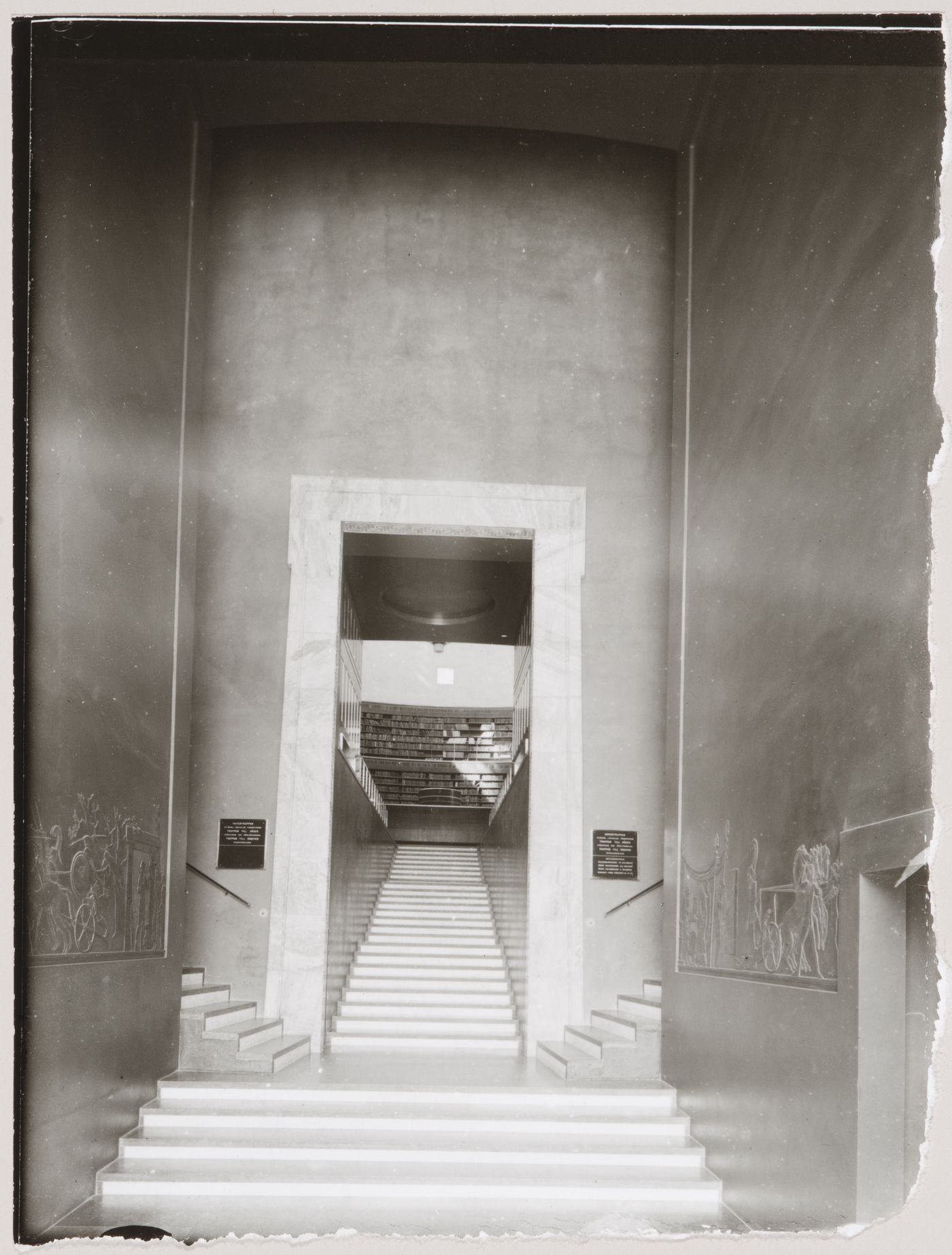 Interior view of the lobby of Stockholm Public Library showing the bas-reliefs depicting scenes from the Iliad sculpted by Ivar Viktor Johnsson and the main stairs leading to the lending hall, 51-55 Odengatan, Stockholm