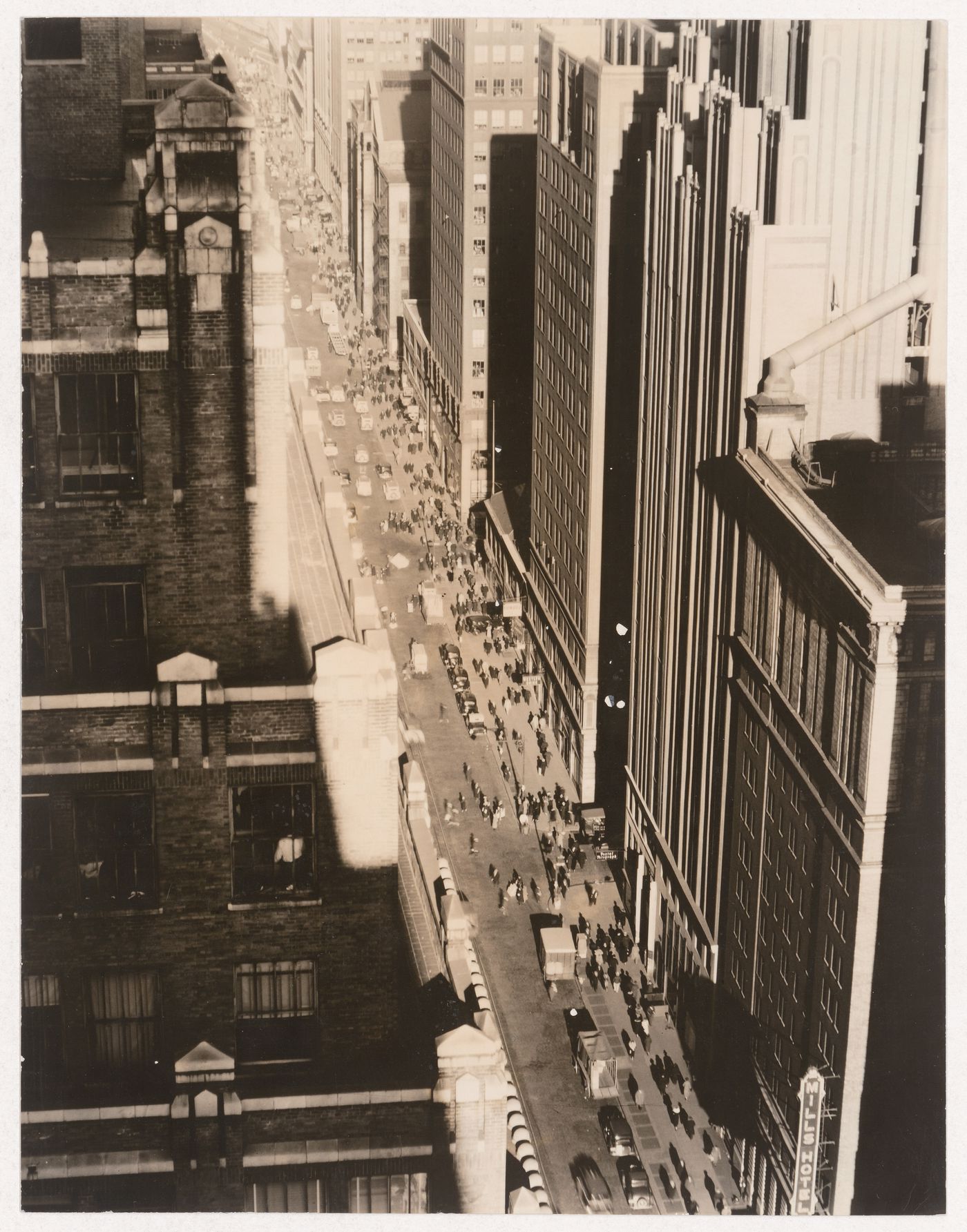 View of Seventh Ave. looking north from 35th St., showing the Mills Hotel at 36th St. and the Metropolitan Opera House at 39th St., New York City, New York