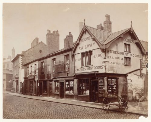 View of shops in Long Millgate, including Moore's Railway Refreshment Rooms, Manchester, England
