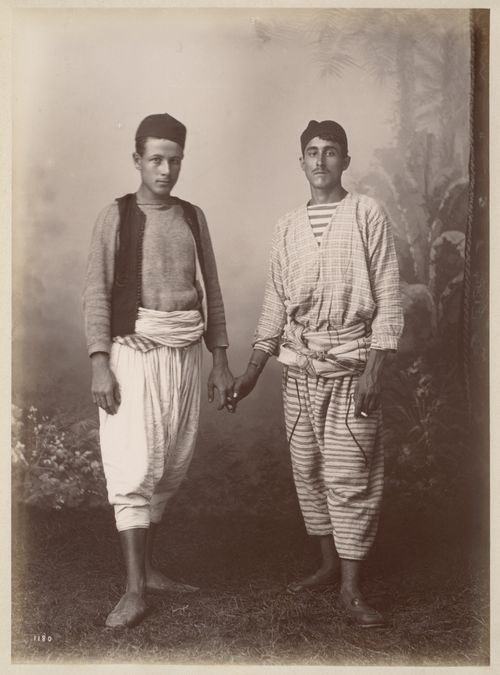 Studio portrait of two young men, Algeria