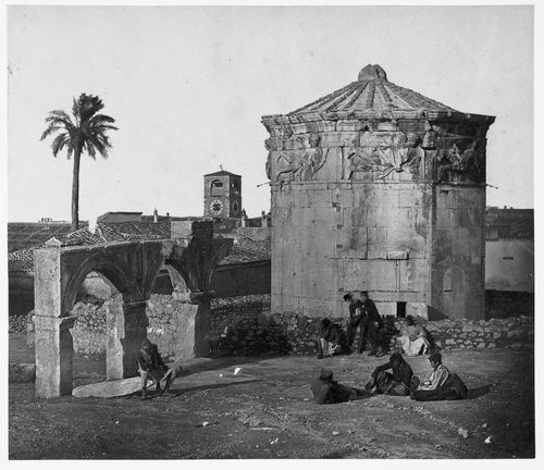 Tower of the Winds with figures in foreground, Athens, Greece