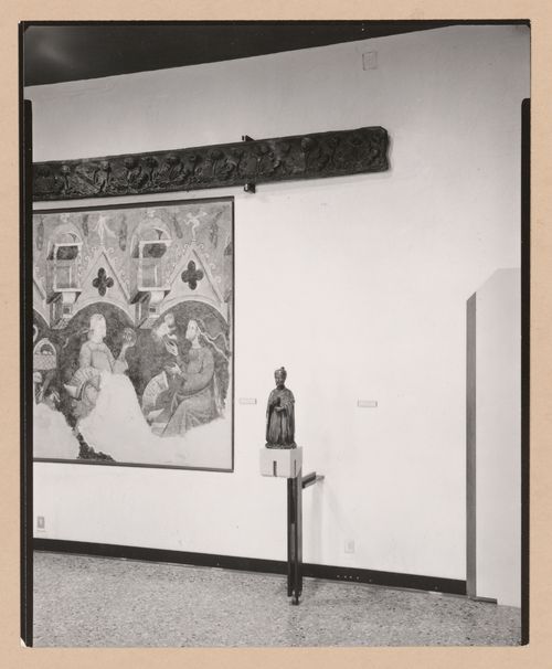 Interior view of a gallery showing a sculpture of a kneeling man and a painting, Museo Correr, Venice, Italy
