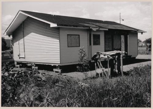 Field Work in Montreal: View of a wooden shack-like structure and a house on blocks, Montréal, Québec