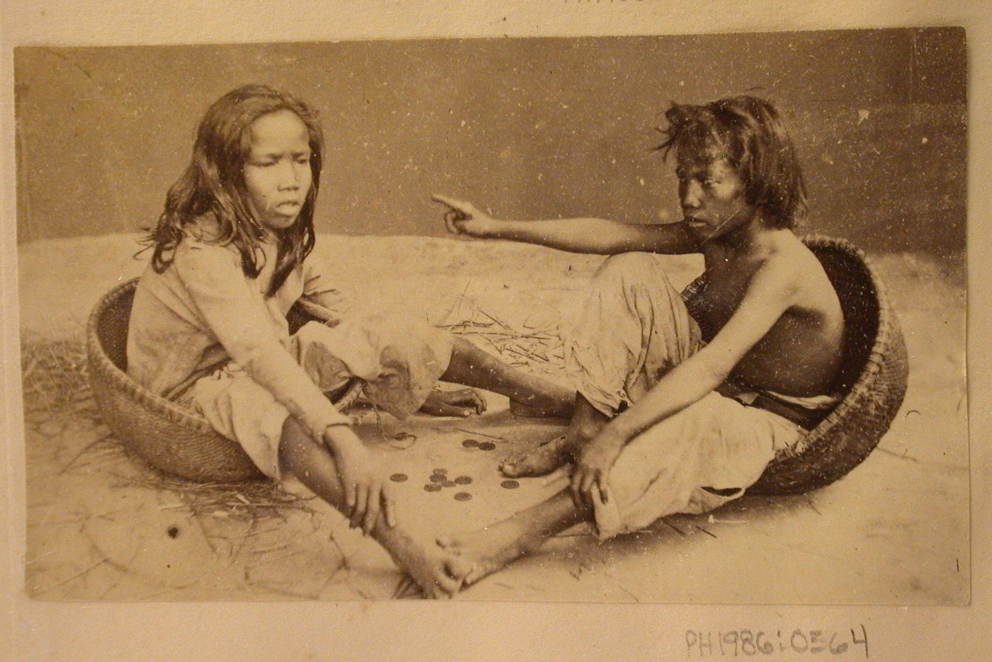 Group portrait of two people, probably in Cochin China (now in Vietnam)