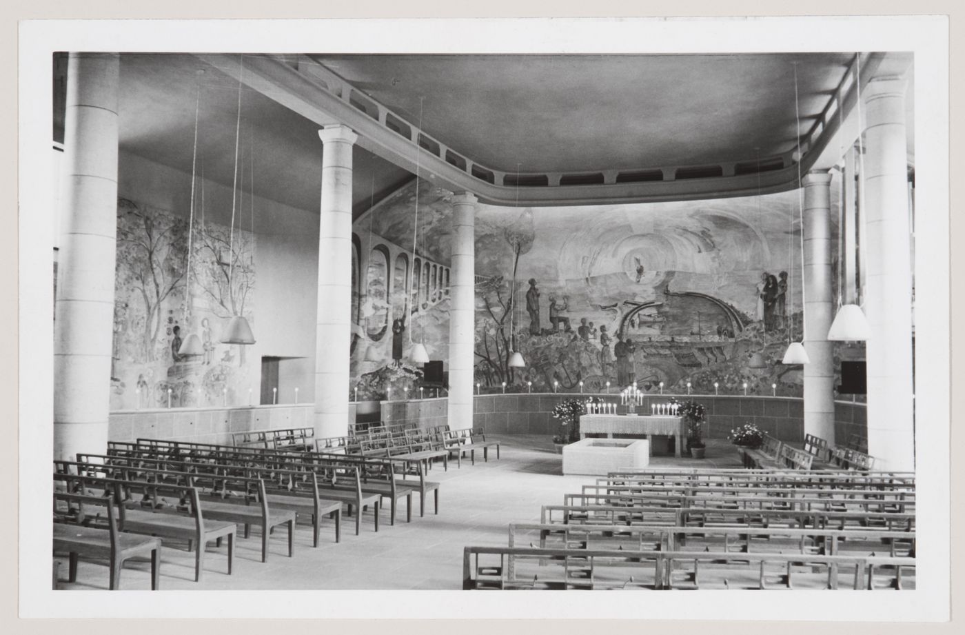 Interior view of the Chapel of the Holy Cross showing pews, the altar and the fresco designed by Sven Erixson, Woodland Crematorium and Cemetery, Stockholm