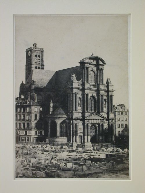 View of façade and tower of St. Gervais, scattered blocks of stone in foreground, Paris, France