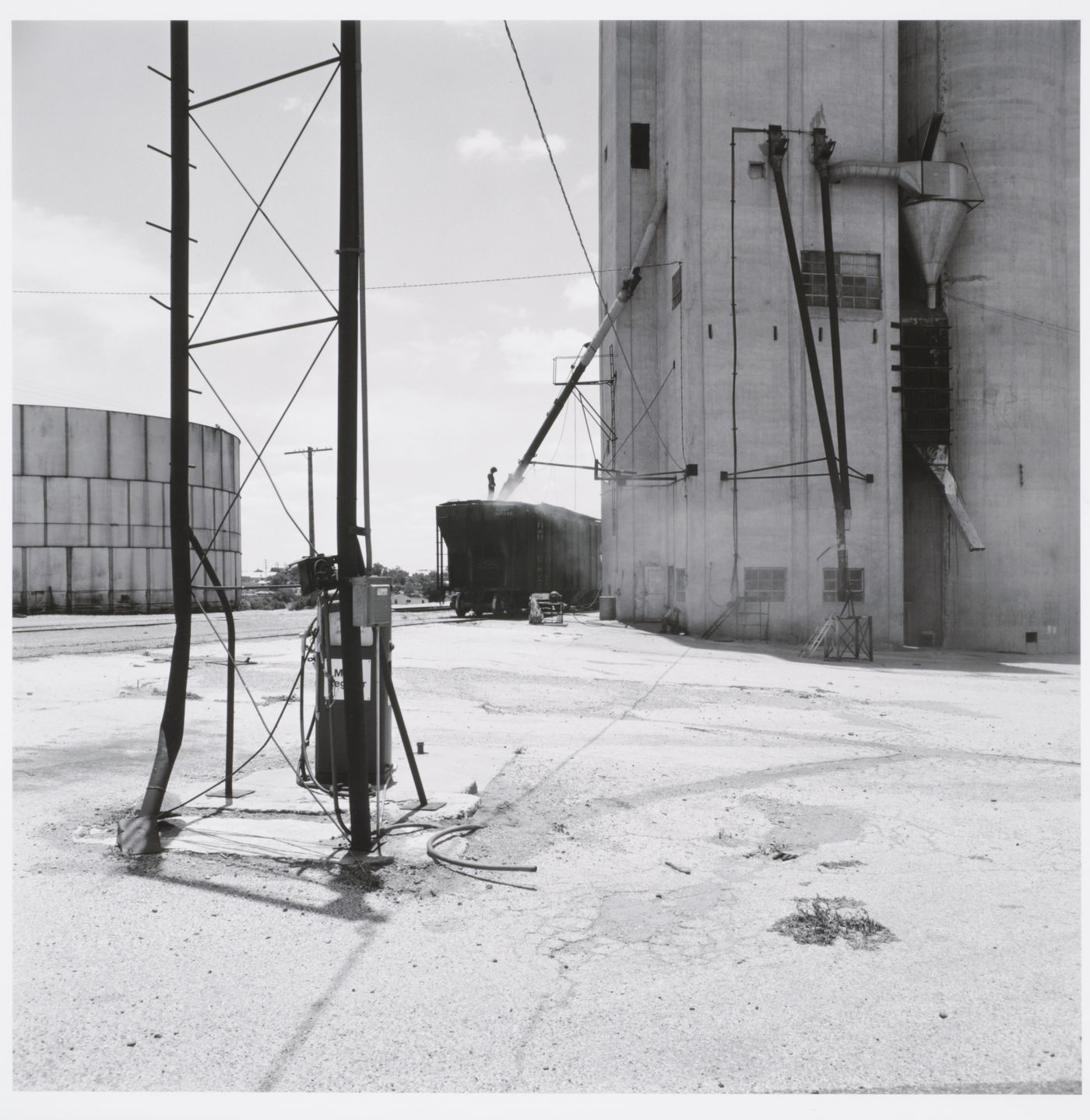 Loading grain at the Goodpasture elevator, Brownfield, Texas 1975
