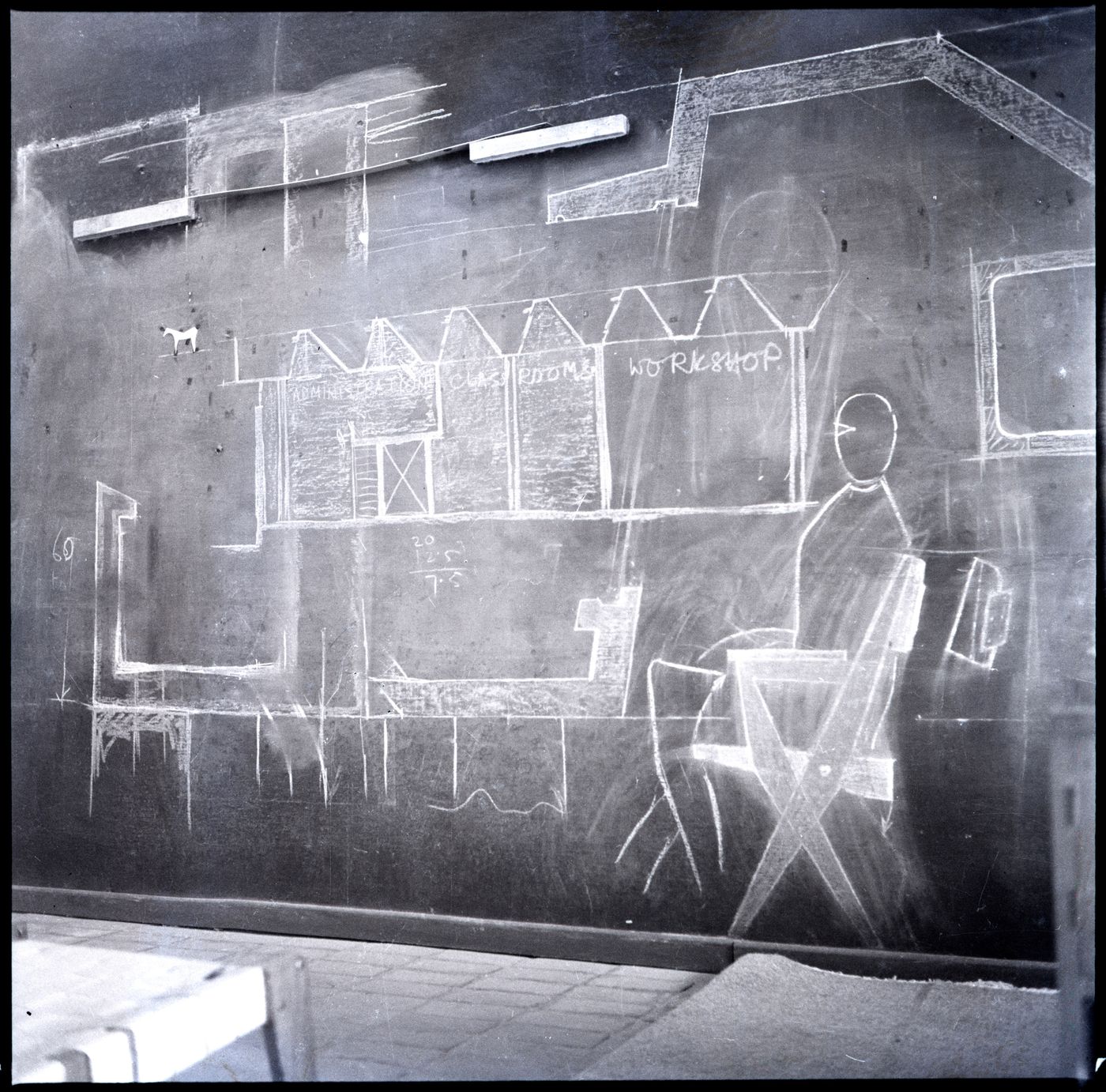 Negative of sketch of the Tagore Theatre chair on a blackboard