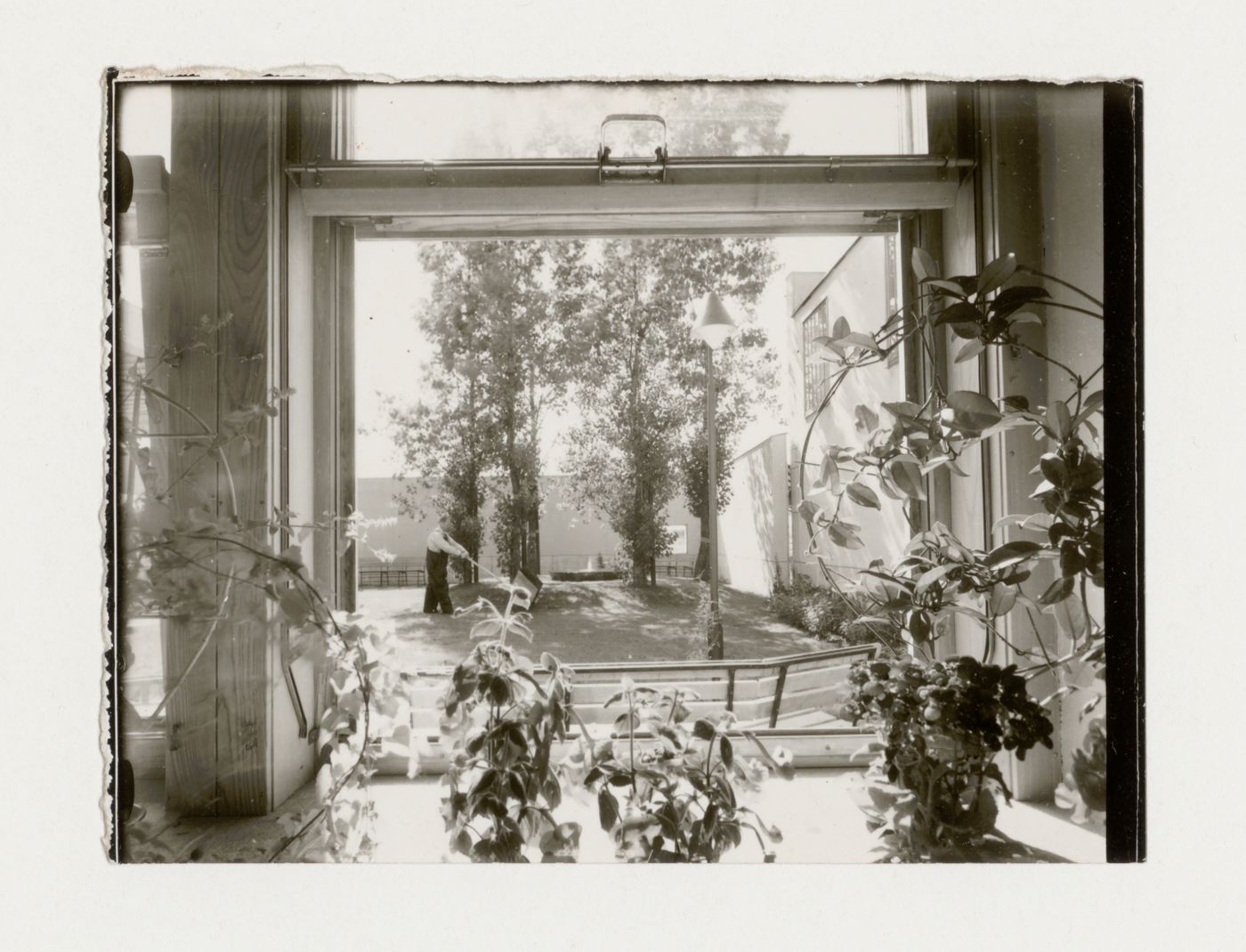 View of the courtyard of the Chapel of the Holy Cross through a chapel window, Woodland Crematorium and Cemetery, Stockholm