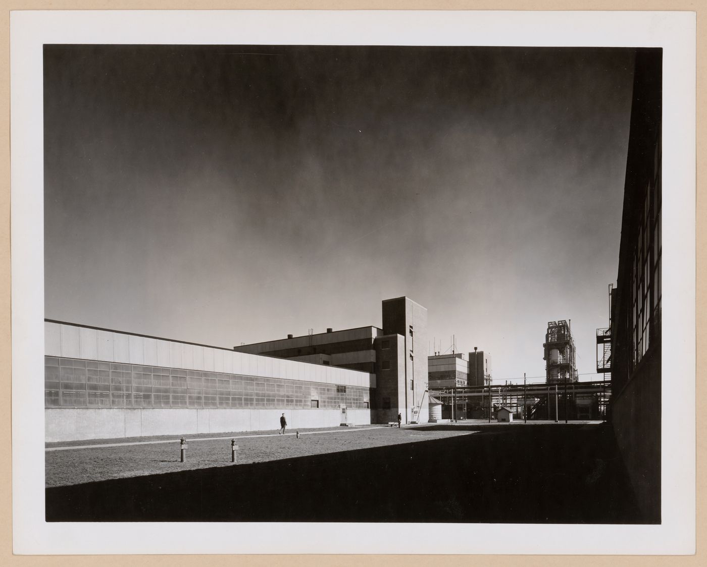 View of the principal façade of a warehouse with the Coagulation Building in the background, B.F. Goodrich Company Geon Plant, Louisville, Kentucky