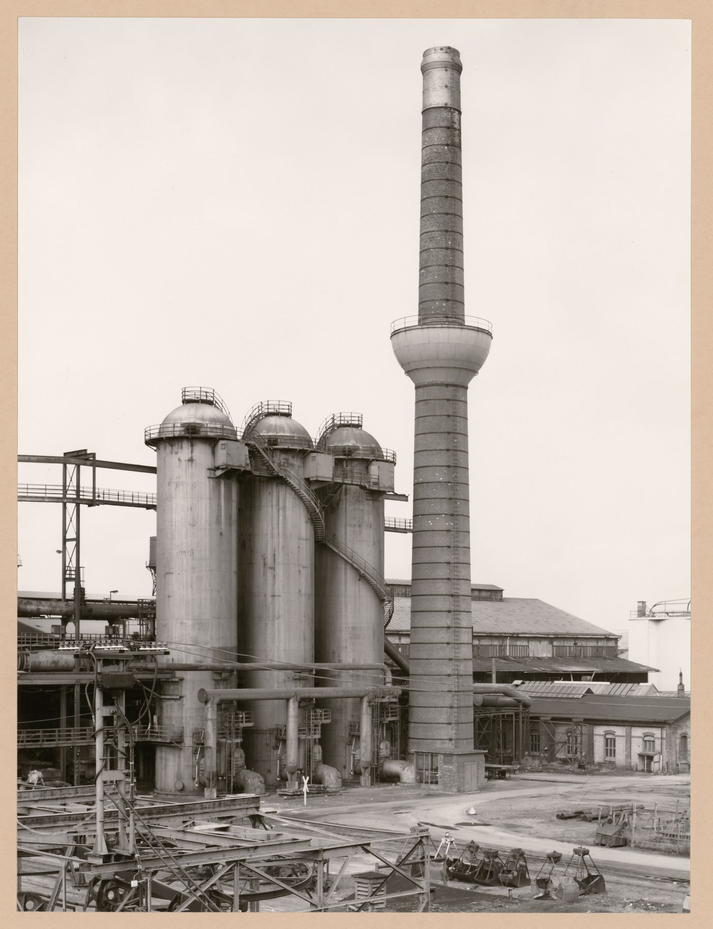 View of Metallhüttenwerk industrial plant showing hot blast stoves and a chimney, Lübeck-Herrenwyk, Germany