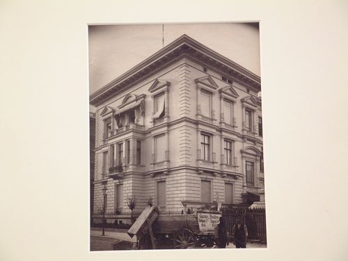 Corner view of Villa Cornwocdz, showing two façades with workmen and cart, Berlin, Germany