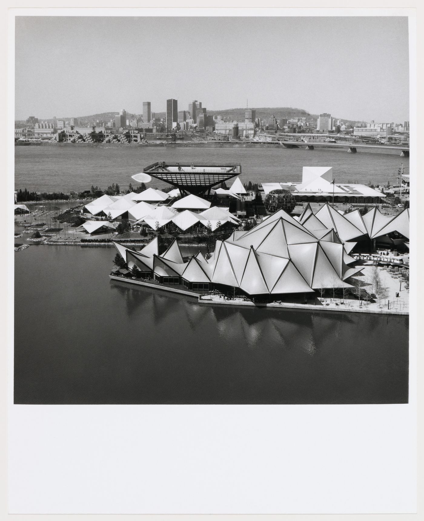 Aerial view of the Ontario and Canada's Pavilions with Montreal in background, Expo 67, Montréal, Québec