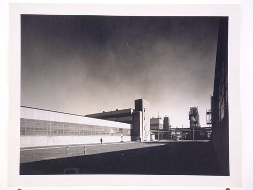 View of the principal façade of a warehouse with the Coagulation Building in the background, B.F. Goodrich Company Geon Plant, Louisville, Kentucky
