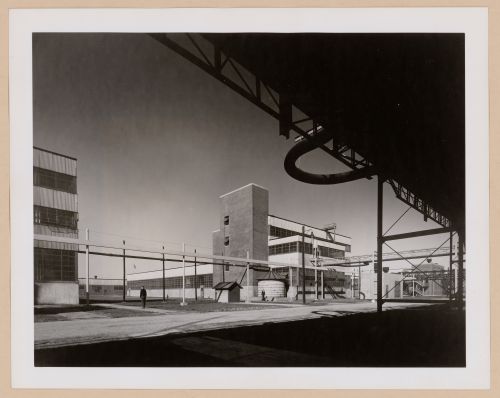 View of the principal and lateral façades of the Coagulation Building with a warehouse in the background, B.F. Goodrich Company Geon Plant, Louisville, Kentucky